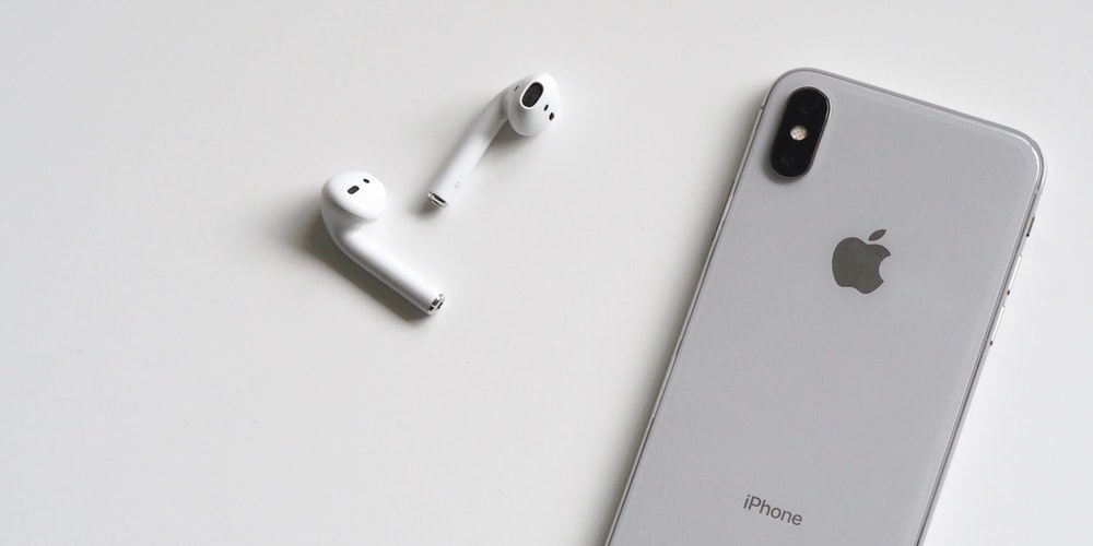 silver iphone x with airpods 788946